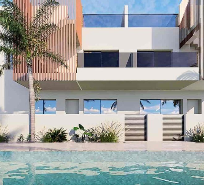 Complexe d'appartements moderne à Pilar de la Horadada, avec une façade blanche épurée, ornée de panneaux en bois. Au premier plan, une piscine cristalline entourée de palmiers et de végétation tropicale