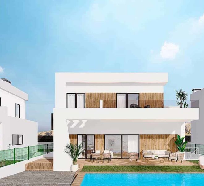 Résidence moderne blanche à Finestrat, à plusieurs étages avec des accents en bois, entourée d'une piscine bleue, de chaises longues blanches et de palmiers, sous un ciel bleu légèrement nuageux avec un arrière-plan montagneux