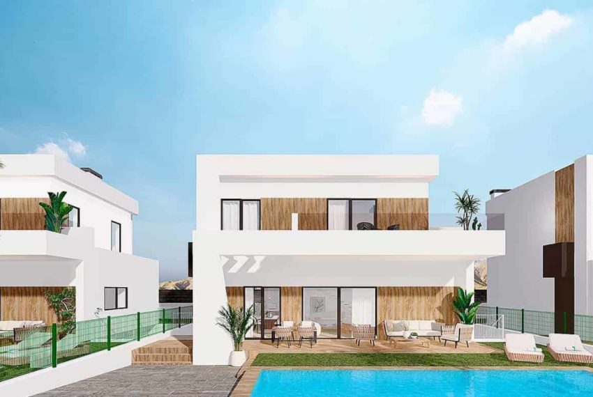 Résidence moderne blanche à Finestrat, à plusieurs étages avec des accents en bois, entourée d'une piscine bleue, de chaises longues blanches et de palmiers, sous un ciel bleu légèrement nuageux avec un arrière-plan montagneux